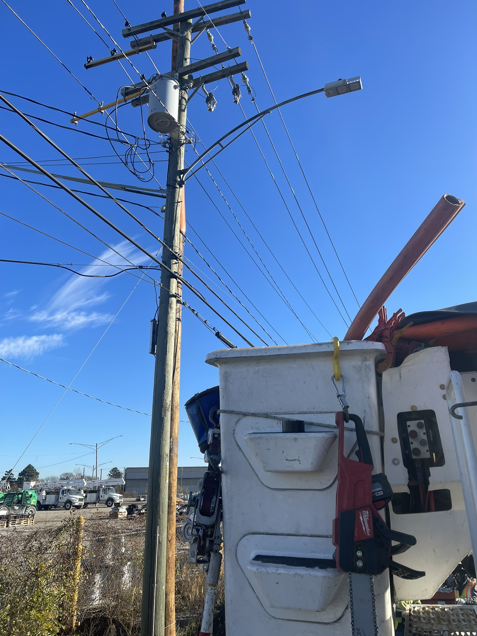 Utility bucket truck at work site