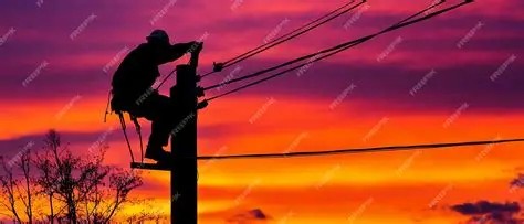 Lineman working at sunset